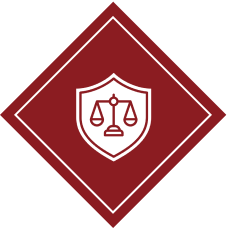 Shield emblem with balanced scales symbolizing justice on a maroon diamond background.