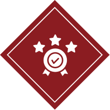 Icon of a badge with checkmark and stars on a red diamond background.